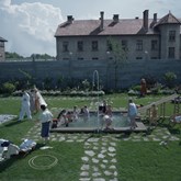 Image of a garden party in the house next to Auschwitz, setting of the Zone of Interest.