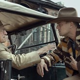 Leonardo DiCaprio and Robert De Niro taking by a car in Martin Scorsese Killers of the Flower Moon. 