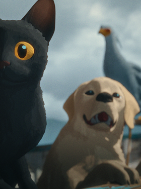 Some animals in front of a cloudy sky